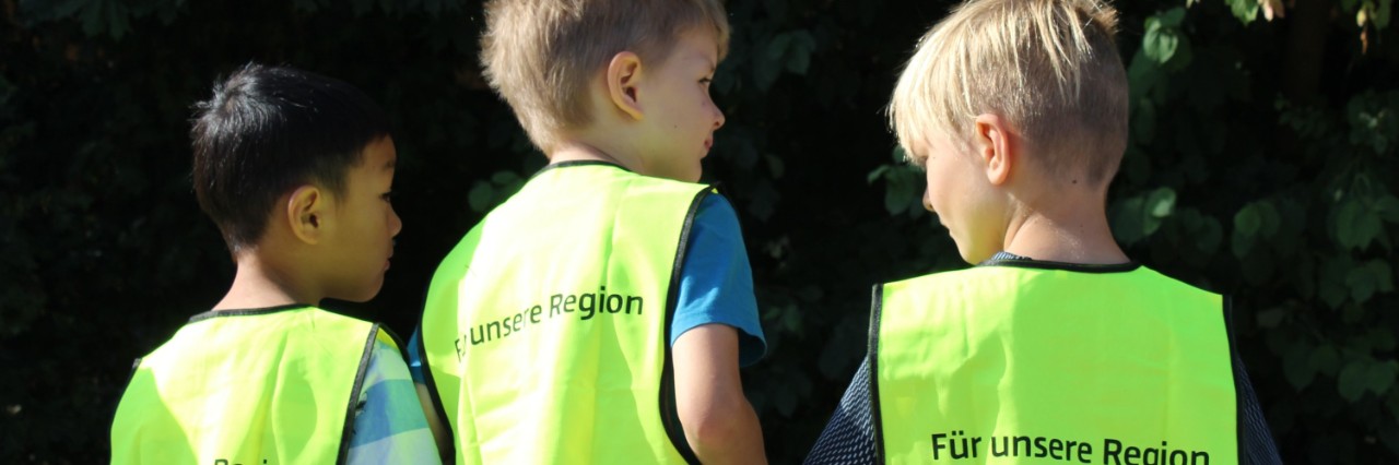 Children wearing high-visibility vests