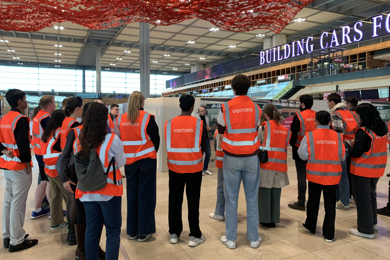 A group of young people in an airport terminal
