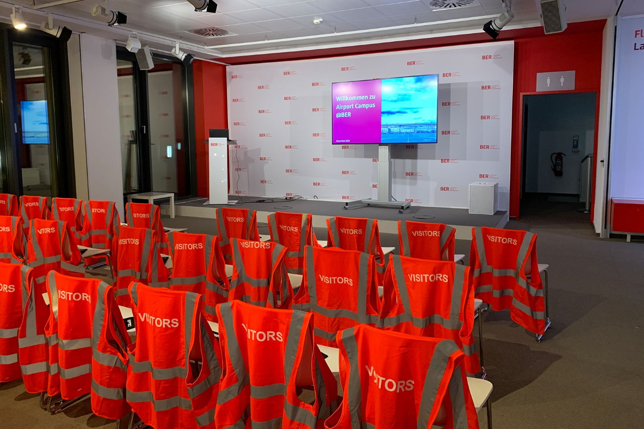 Before the start: An event room with many empty chairs