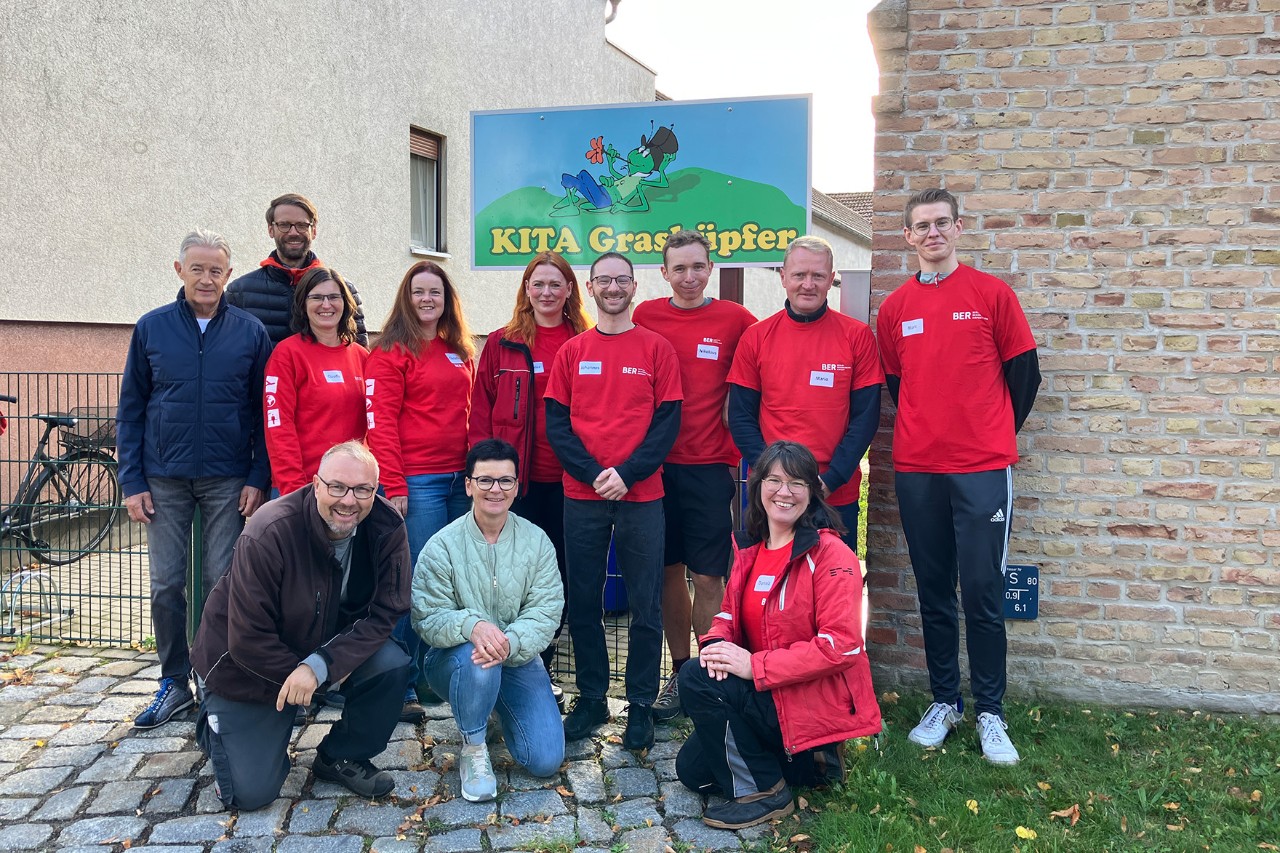 Group photo of people in red T-shirts