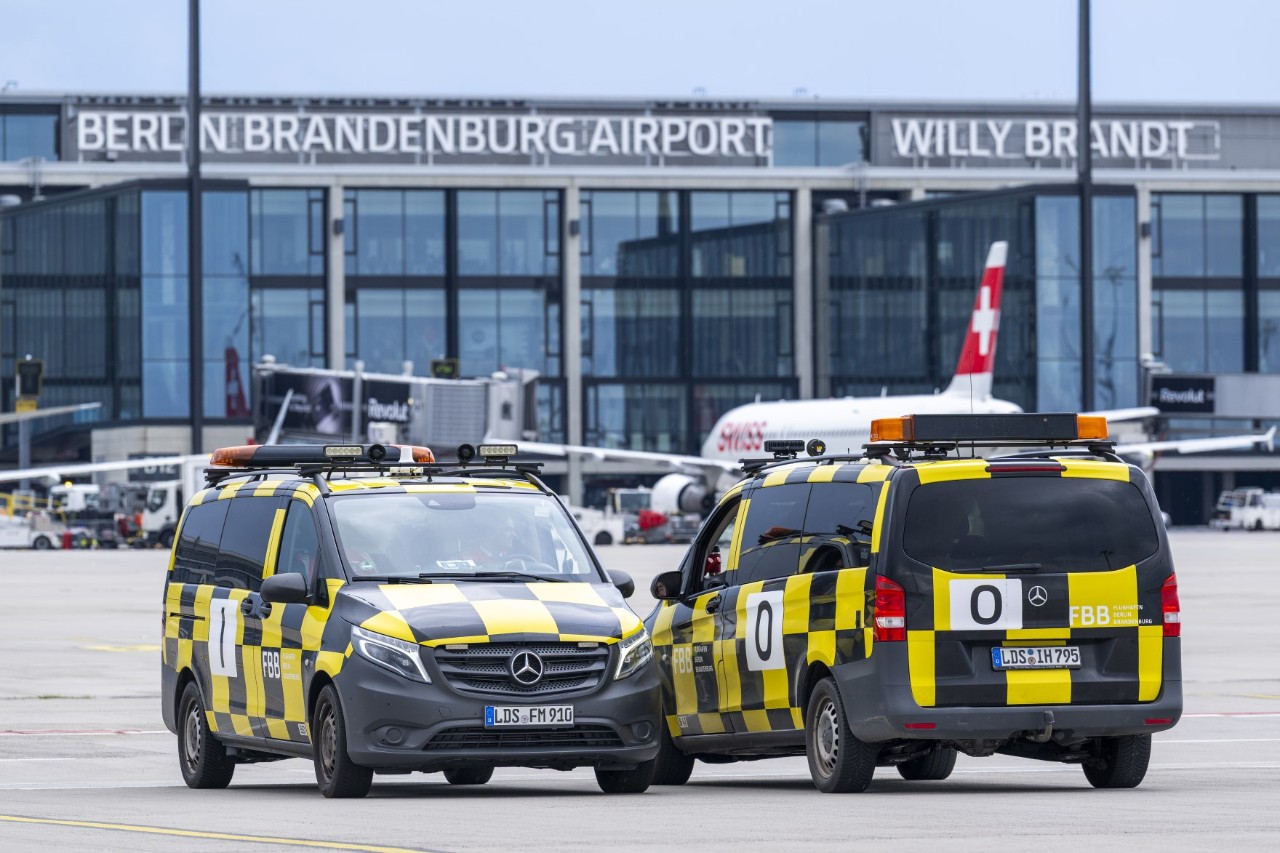 Two follow-me vehicles on the apron