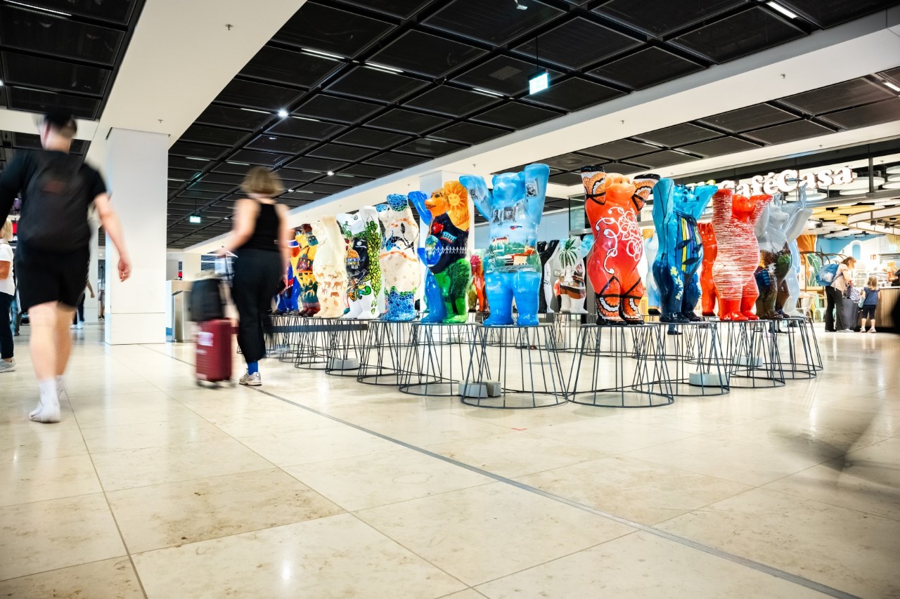 Buddy bears on small pedestals in the terminal 