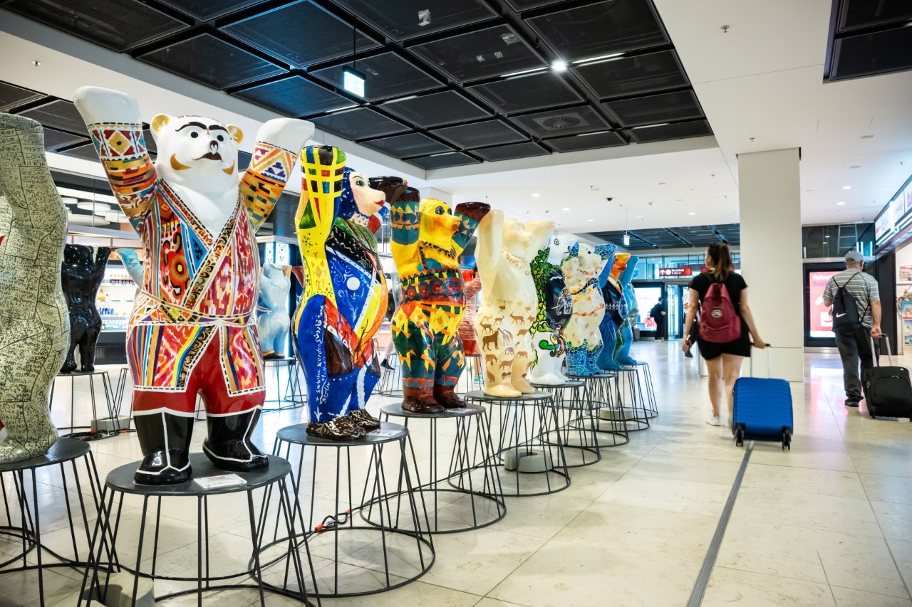 Buddy bears on small pedestals in the terminal 
