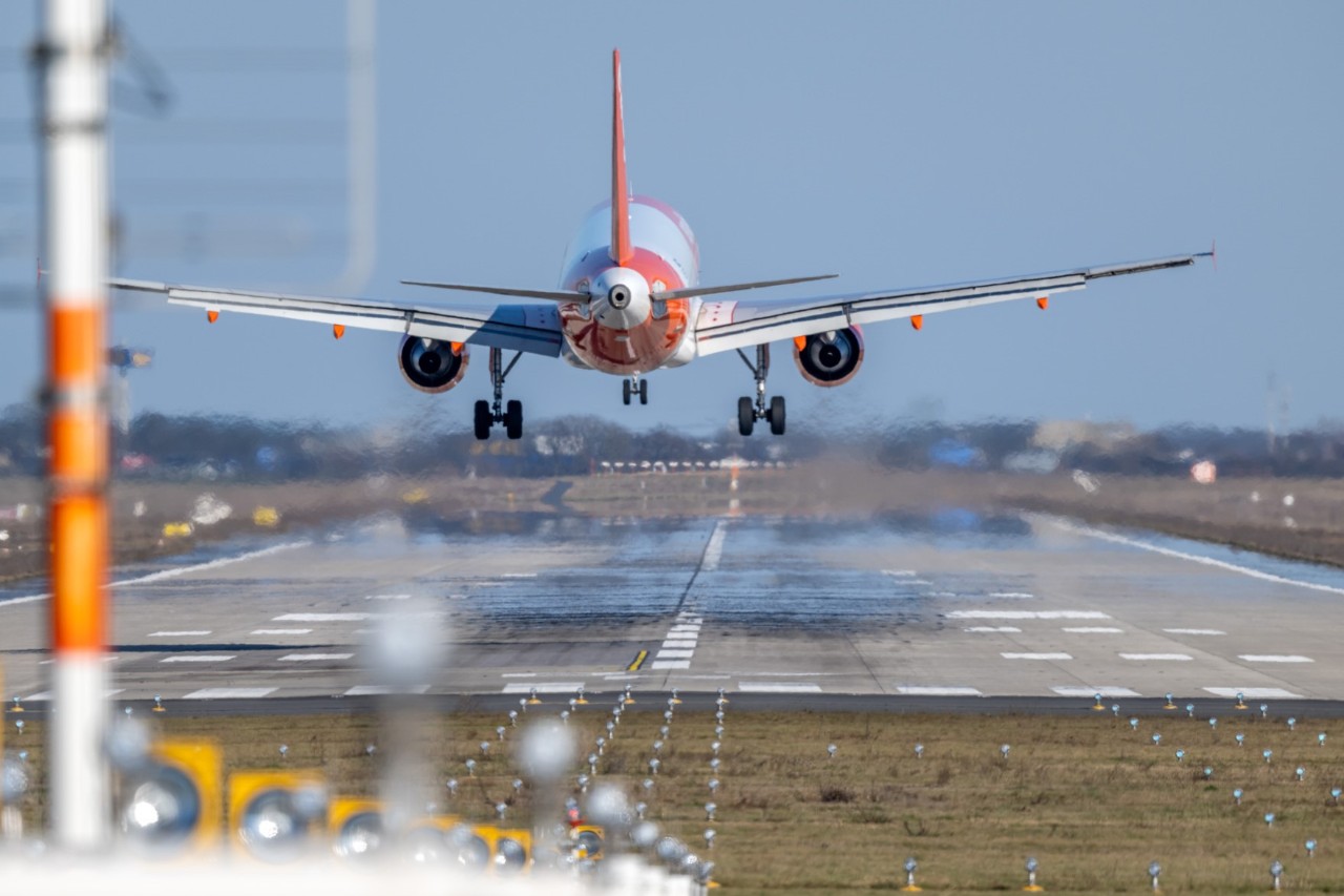Aircraft shortly before touching down on the runway