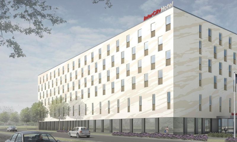 Side view of a square hotel building as a visualization, with trees and cars in the foreground.