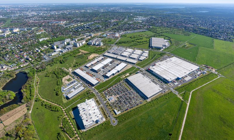 Aerial view of a business park with buildings and parking lots